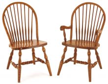 Light wooden round back chairs