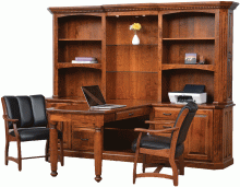 wooden conference desk with black leather chairs
