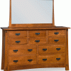 tall wooden vanity with many drawers and mirror