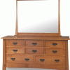wooden vanity with many drawers and tall mirror