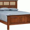 A wooden bed frame with a blue mattress and blue pillows