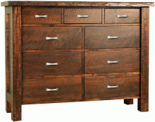 A dark wooden chest of drawers