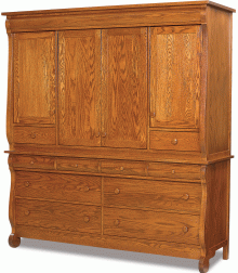 A larger wooden dresser with multiple doors and drawers