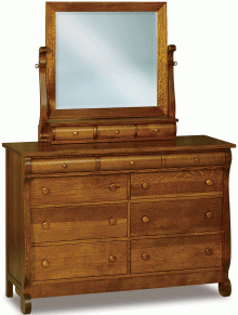A wooden dresser with a mirror