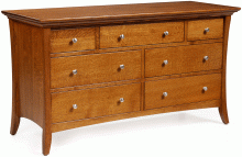 A wooden dresser with multiple drawers