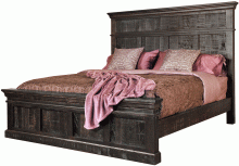 A dark wooden bed frame with a mattress and pillows