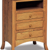 light wooden end piece with 3 drawers and cubby storage space
