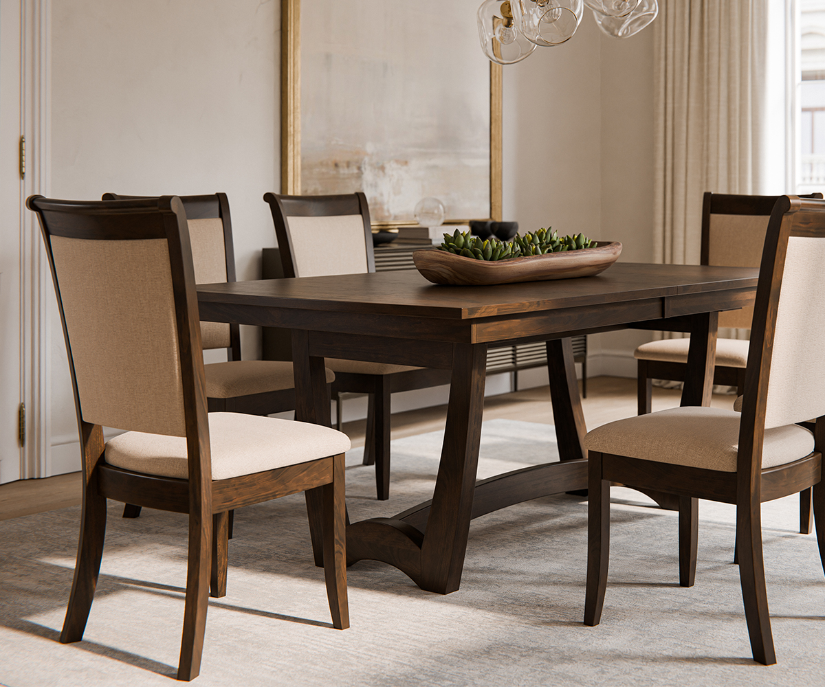 Amish dining table with upholstered chairs in a modern neutral dining room.